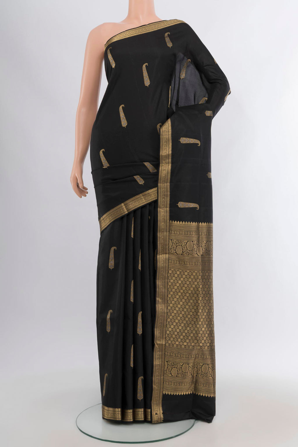 Black Soft Silk Saree with Zari Butta on the body and Zari Border.  displayed on a mannequin