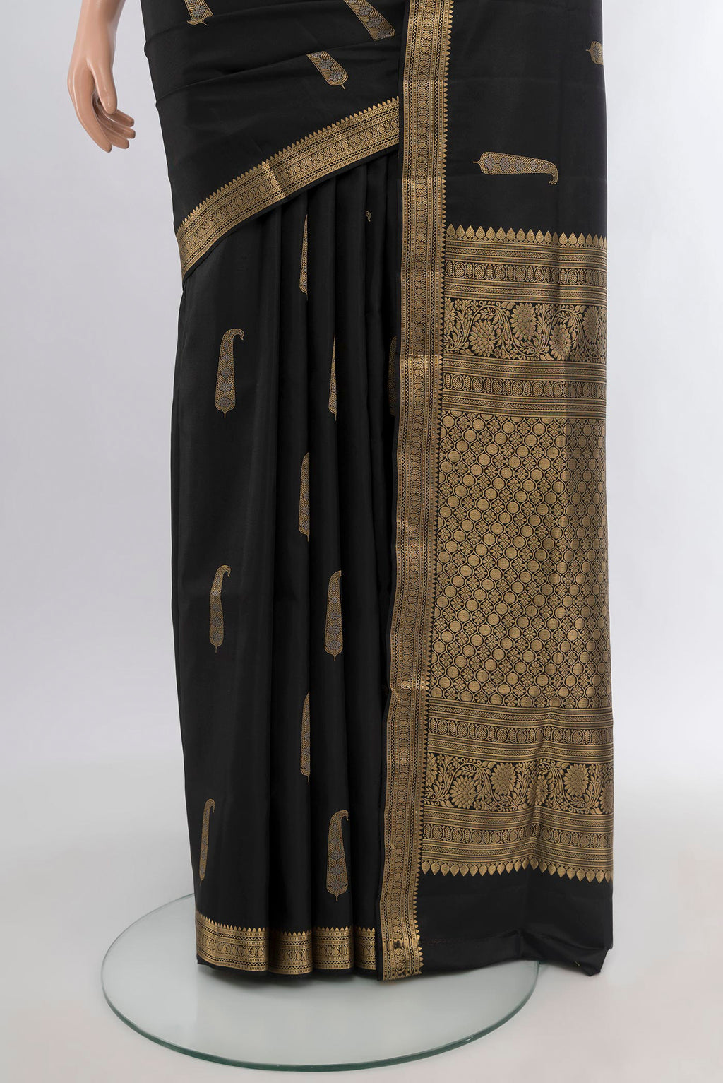 Pleats and pallu of Black Soft Silk Saree with Zari Butta on the body and Zari Border. 