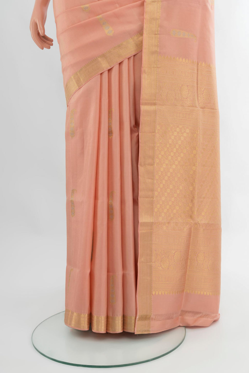Pleats and pallu of Peach Soft Silk Nine Yards Saree with Zari Butta on the body and Zari Border. 