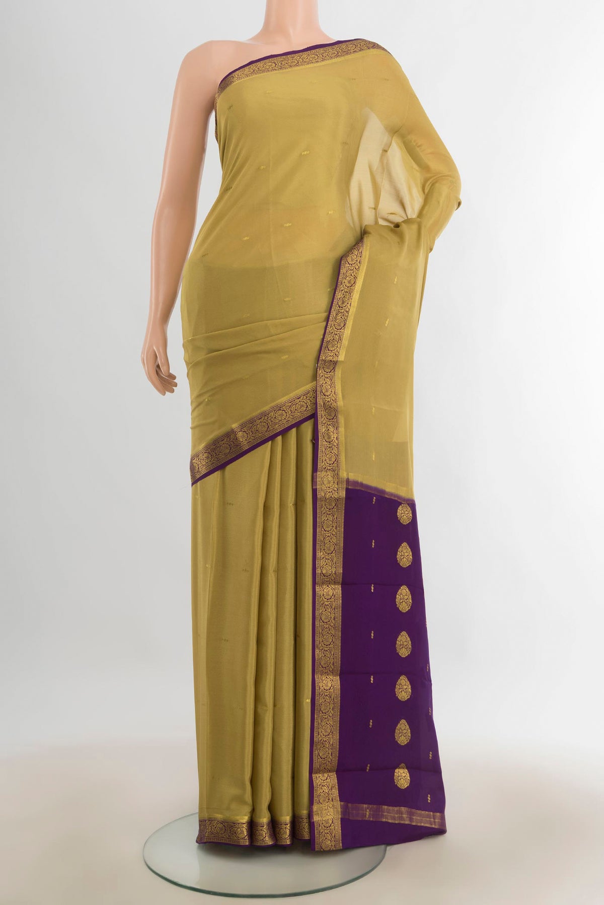Mehandi Green Mysore Crepe Saree with Zari Butta on the body and Silk Border.  displayed on a mannequin