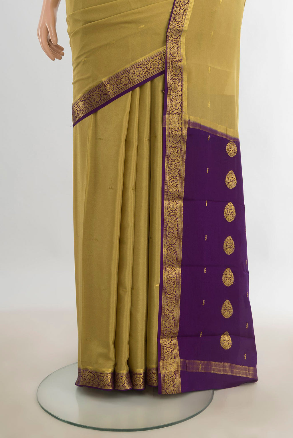 Pleats and pallu of Mehandi Green Mysore Crepe Saree with Zari Butta on the body and Silk Border. 