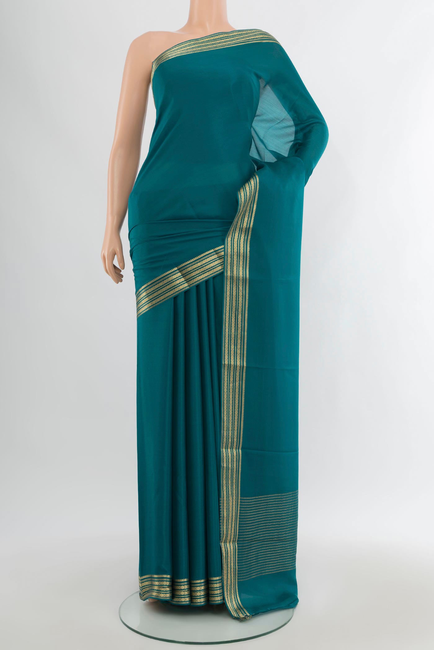 Blue Mysore Crepe Saree with Plain Body and Zari Border.  displayed on a mannequin