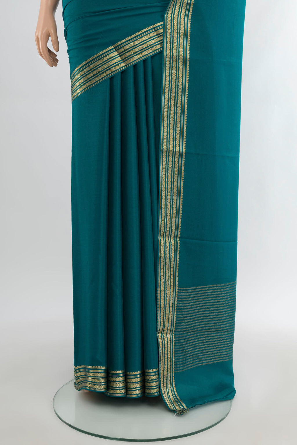 Pleats and pallu of Blue Mysore Crepe Saree with Plain Body and Zari Border. 