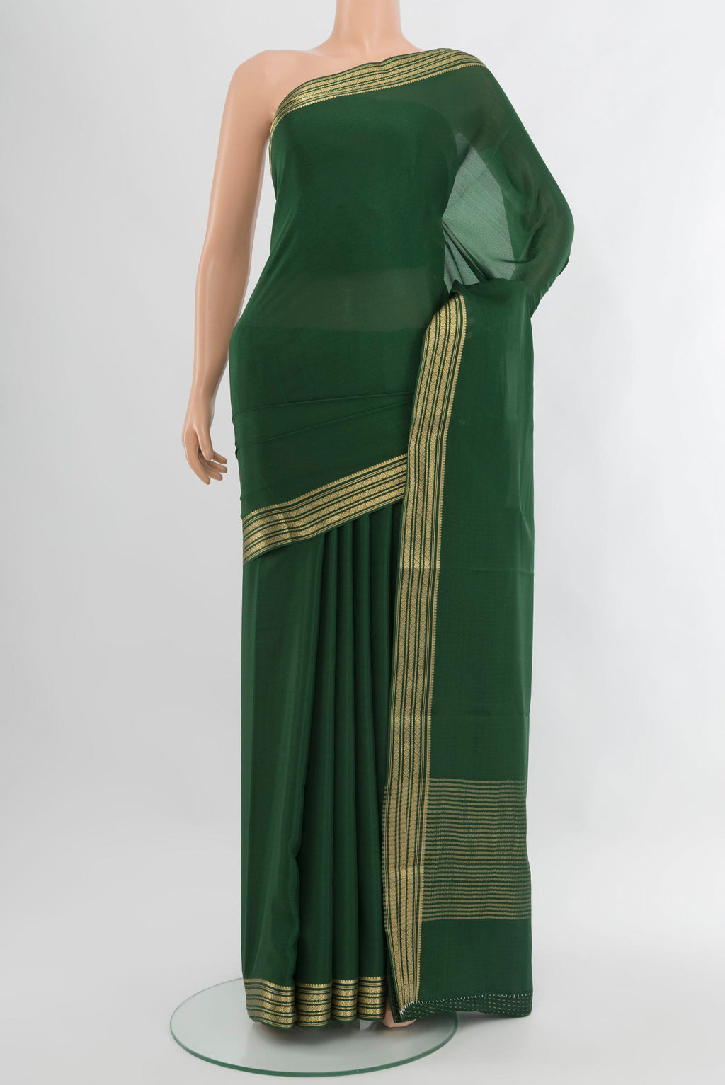 Bottle Green Mysore Crepe Saree with Plain Body and Zari Border.  displayed on a mannequin