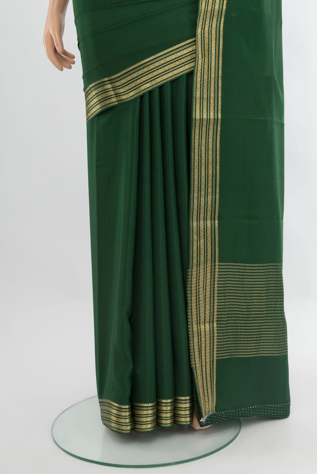 Pleats and pallu of Bottle Green Mysore Crepe Saree with Plain Body and Zari Border. 