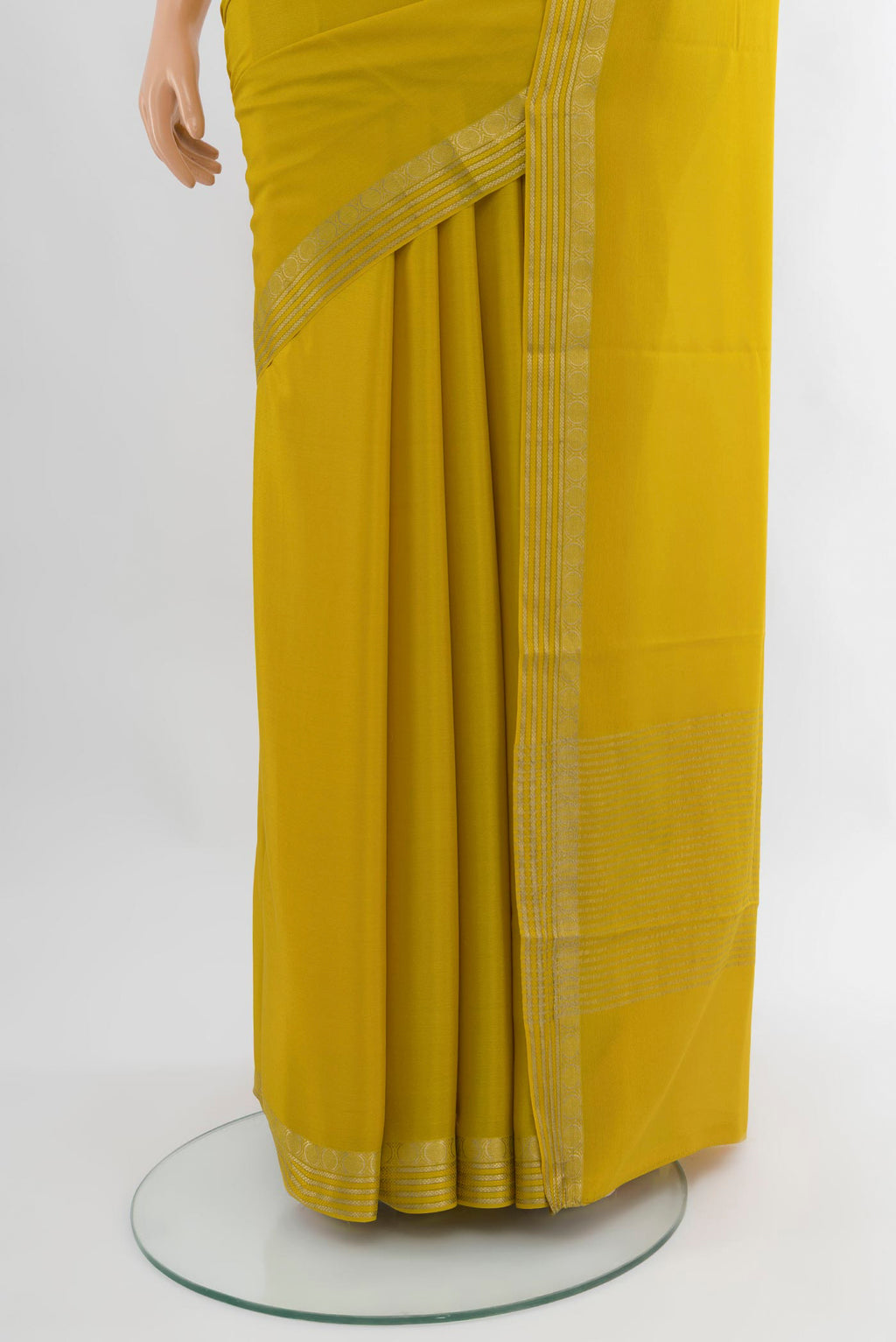 Pleats and pallu of Mustard Mysore Crepe Saree with Plain Body and Zari Border. 