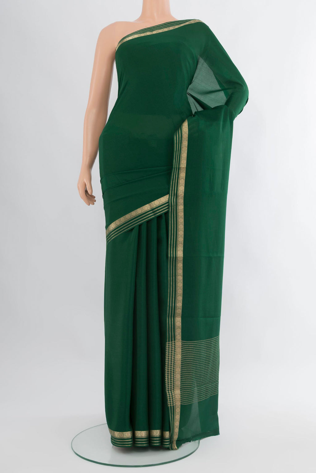 Bottle Green Mysore Crepe Saree with Plain Body and Zari Border.  displayed on a mannequin