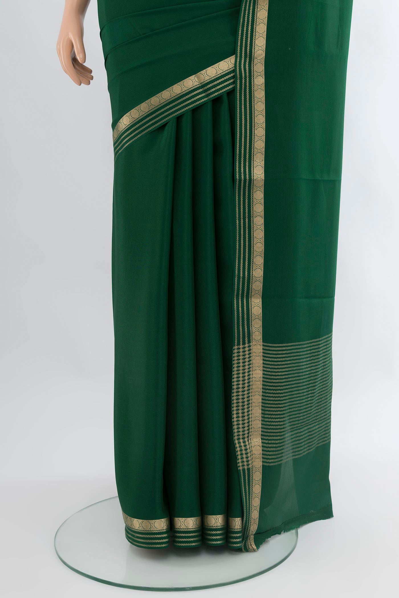 Pleats and pallu of Bottle Green Mysore Crepe Saree with Plain Body and Zari Border. 