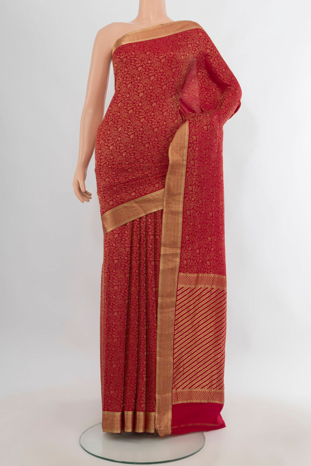 Red Mysore Crepe Saree with Zari Brocade on the body and Zari Border.  displayed on a mannequin