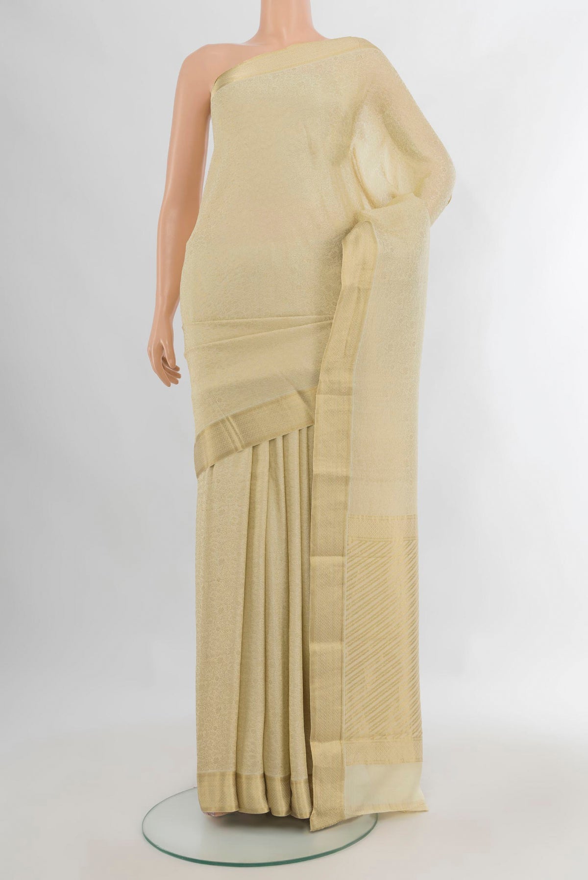 Cream Mysore Crepe Saree with Zari Brocade on the body and Zari Border.  displayed on a mannequin