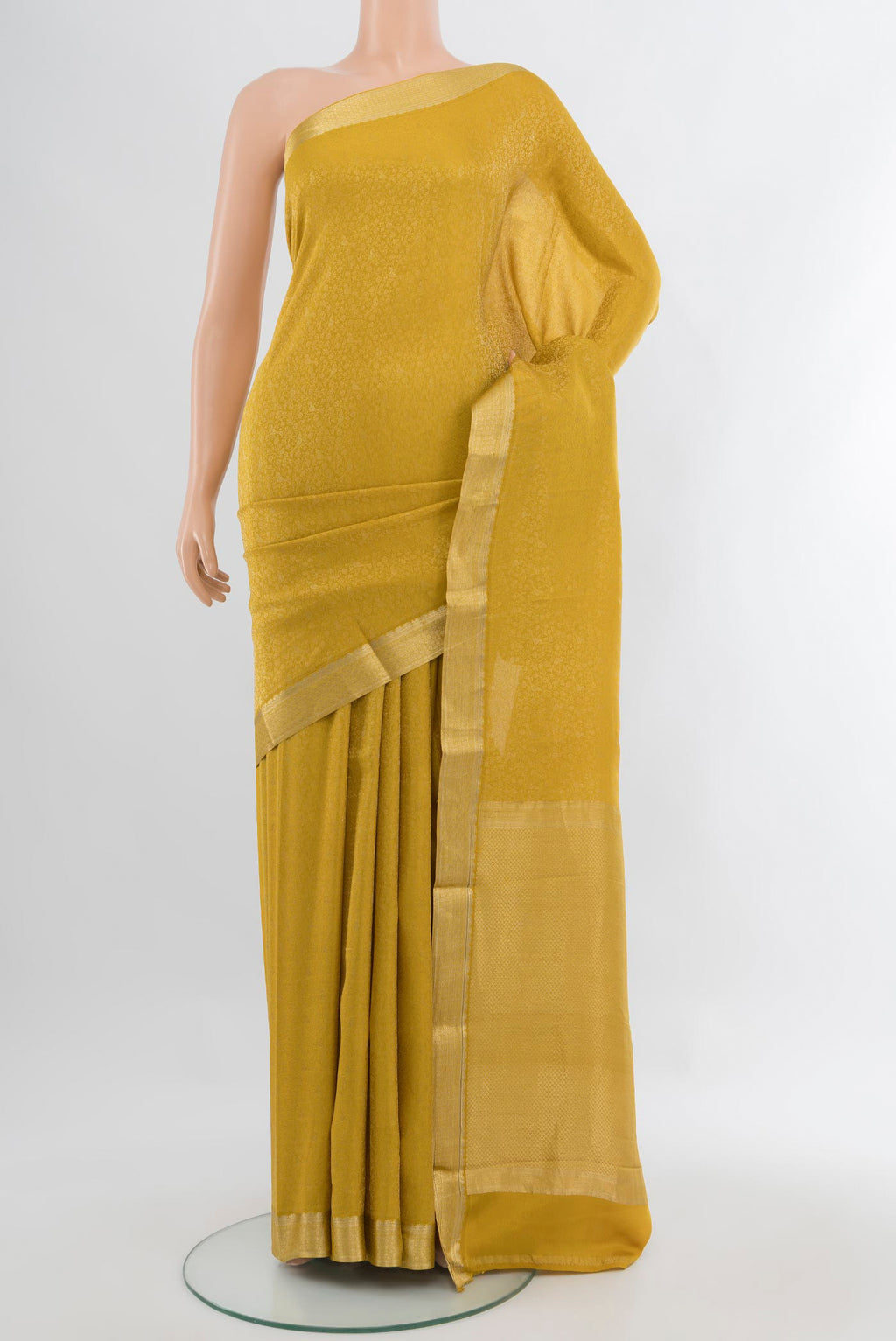 Yellow Mysore Crepe Saree with Zari Brocade on the body and Zari Border.  displayed on a mannequin