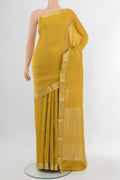 Yellow Mysore Crepe Saree with Zari Brocade on the body and Zari Border.  displayed on a mannequin