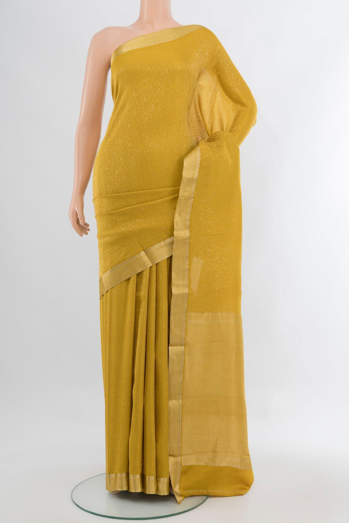 Yellow Mysore Crepe Saree with Zari Brocade on the body and Zari Border.  displayed on a mannequin