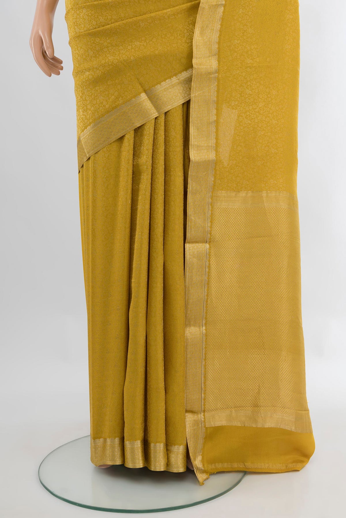 Pleats and pallu of Yellow Mysore Crepe Saree with Zari Brocade on the body and Zari Border. 