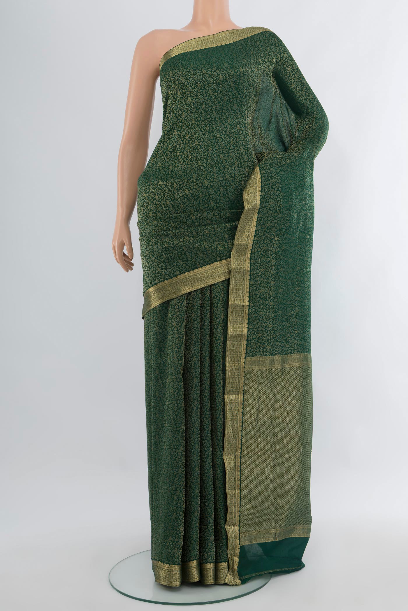 Bottle Green Mysore Crepe Saree with Zari Brocade on the body and Zari Border.  displayed on a mannequin
