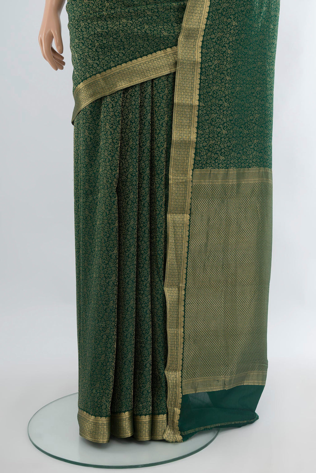 Pleats and pallu of Bottle Green Mysore Crepe Saree with Zari Brocade on the body and Zari Border. 