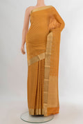 Mustard Mysore Crepe Saree with Zari Brocade on the body and Zari Border.  displayed on a mannequin