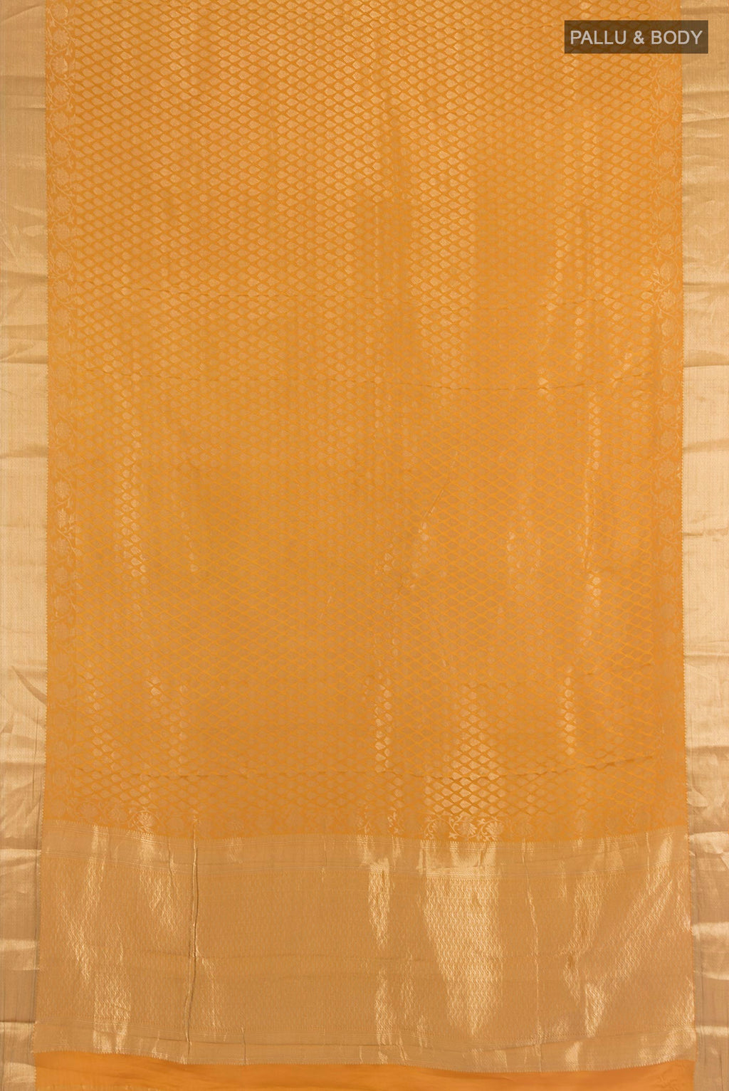 Flat view of Mustard Mysore Crepe Saree with Zari Brocade on the body and Zari Border. 