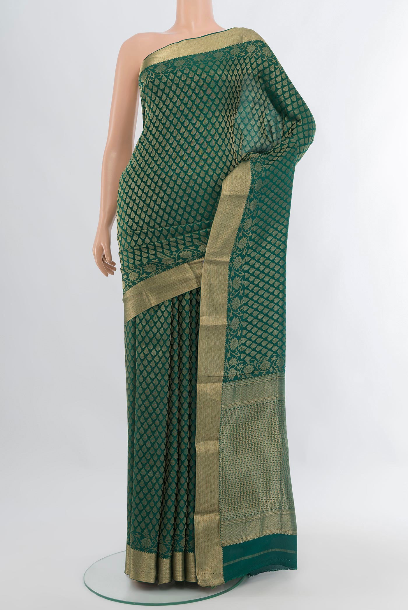Bottle Green Mysore Crepe Saree with Zari Brocade on the body and Zari Border.  displayed on a mannequin