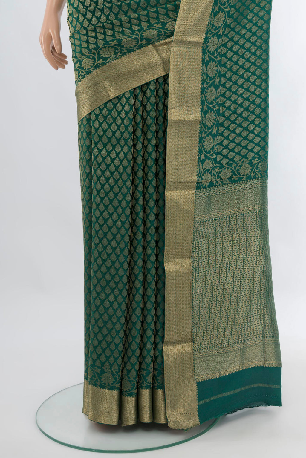 Pleats and pallu of Bottle Green Mysore Crepe Saree with Zari Brocade on the body and Zari Border. 