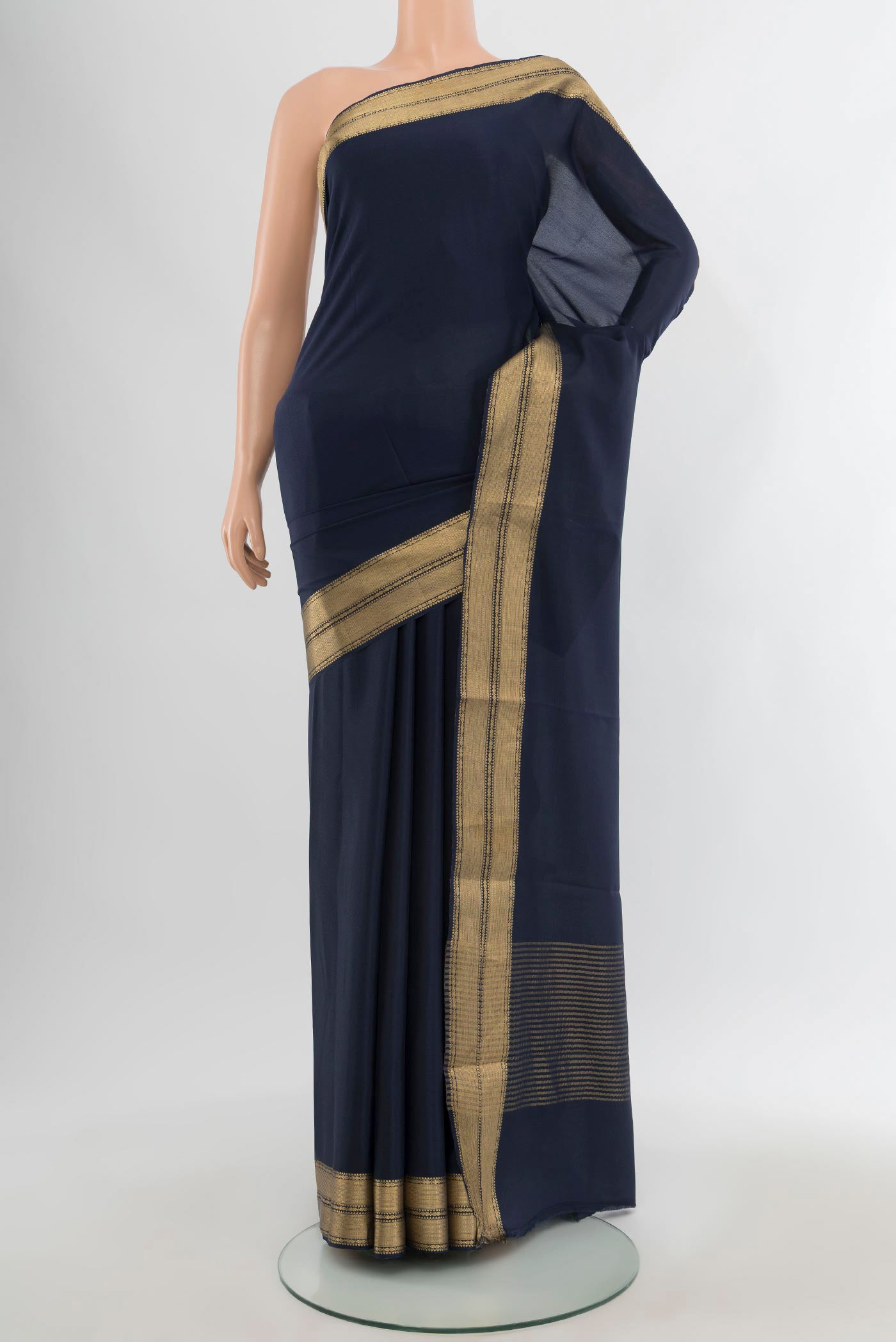 Navy Blue Mysore Crepe Saree with Plain Body and Zari Border.  displayed on a mannequin