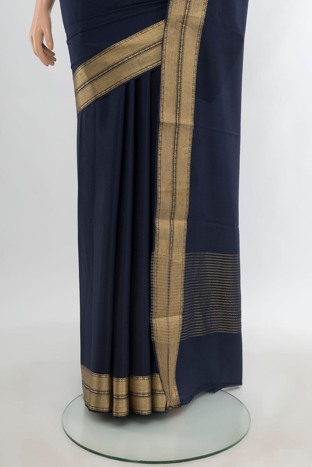 Pleats and pallu of Navy Blue Mysore Crepe Saree with Plain Body and Zari Border. 