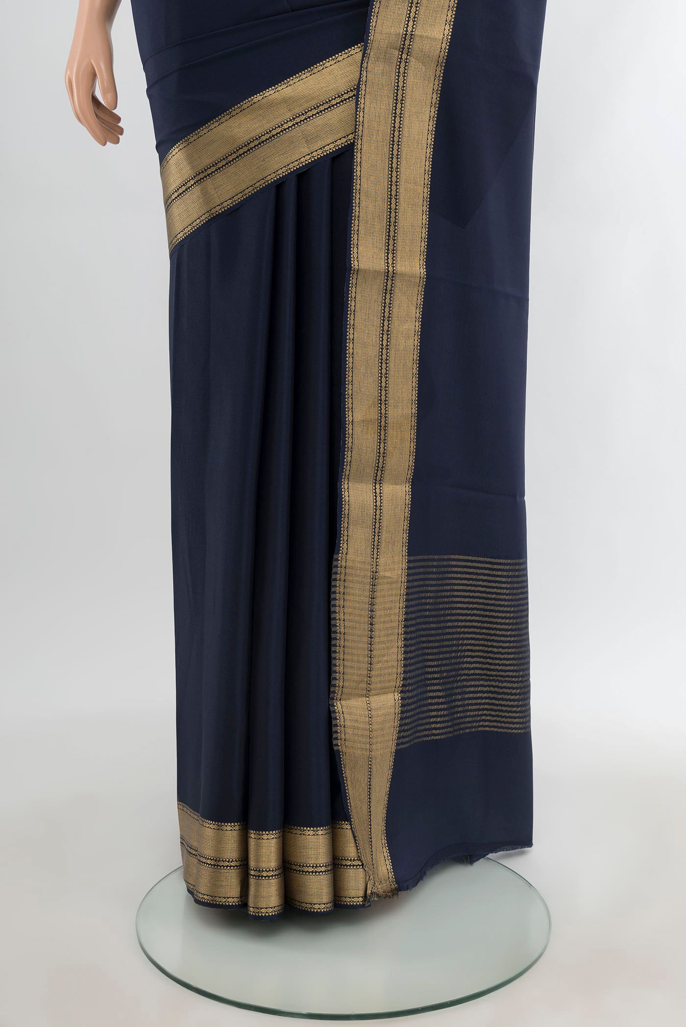 Pleats and pallu of Navy Blue Mysore Crepe Saree with Plain Body and Zari Border. 