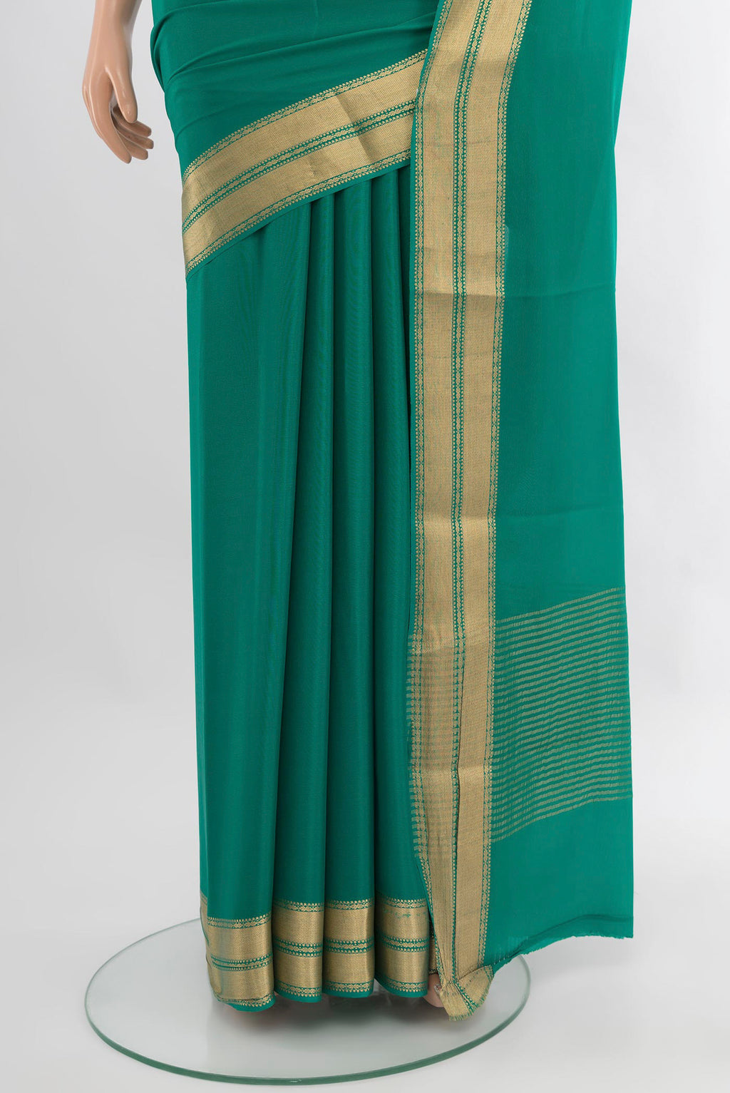 Pleats and pallu of Teal Mysore Crepe Saree with Plain Body and Zari Border. 
