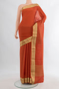 Orange Mysore Crepe Saree with Plain Body and Zari Border.  displayed on a mannequin
