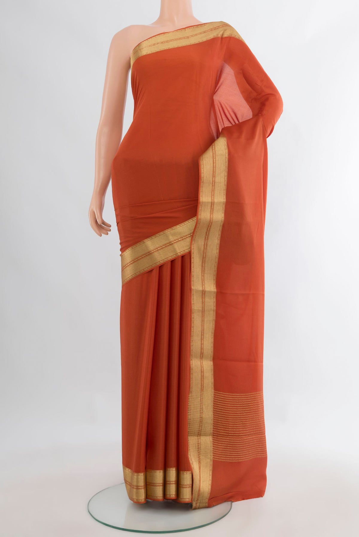 Orange Mysore Crepe Saree with Plain Body and Zari Border.  displayed on a mannequin