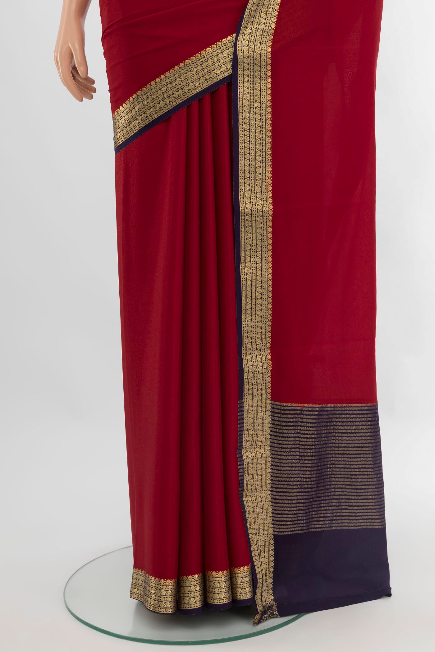 Pleats and pallu of Red Mysore Crepe Saree with Plain Body and Zari Border. 