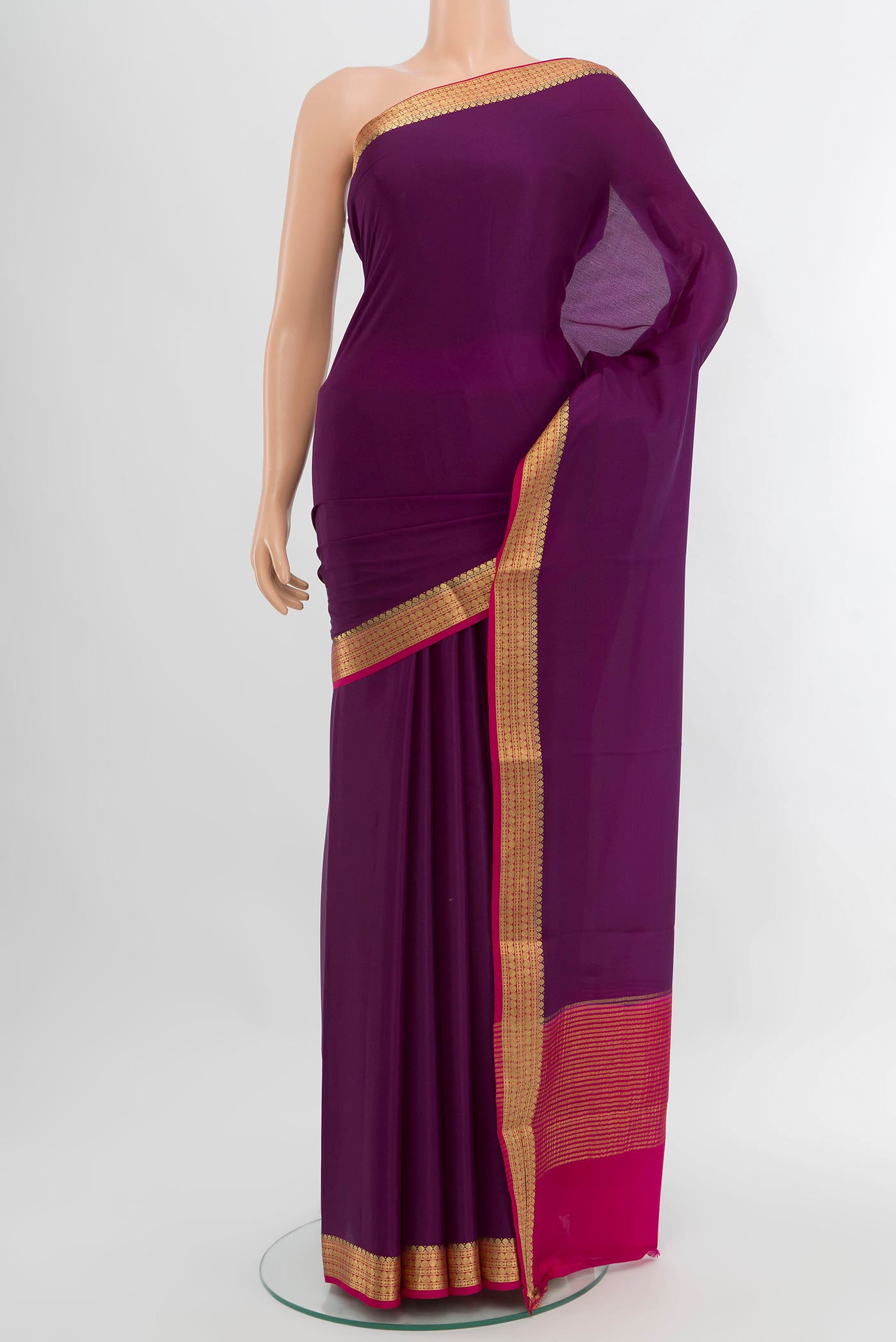Violet Mysore Crepe Saree with Plain Body and Zari Border.  displayed on a mannequin