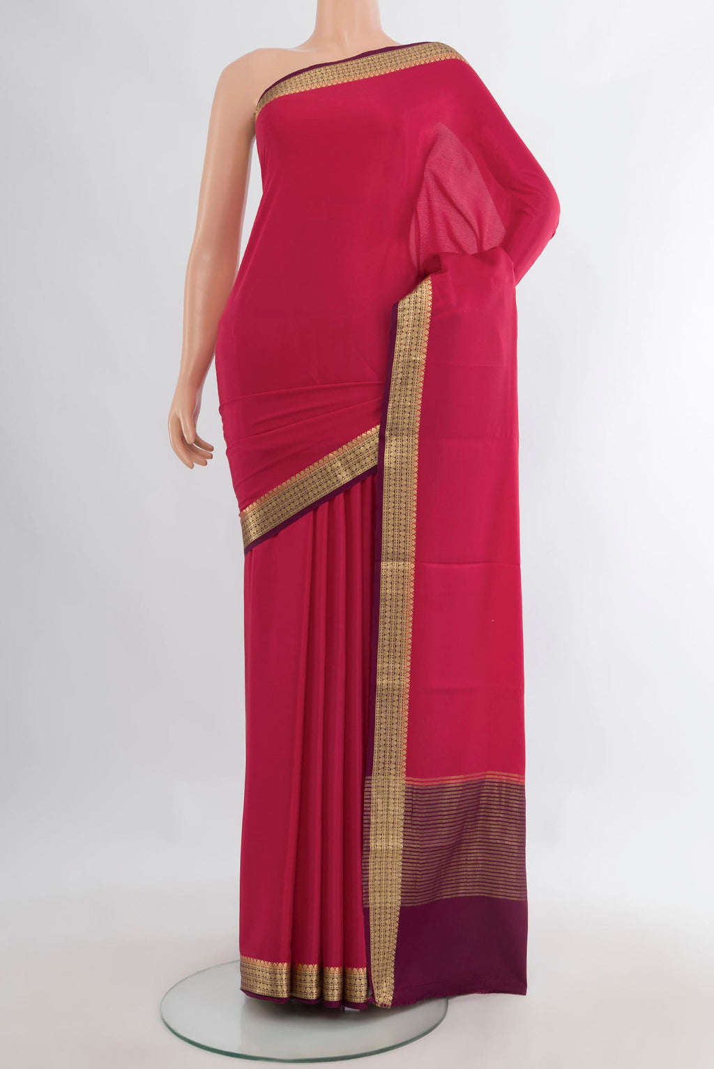 Dark Pink Mysore Crepe Saree with Plain Body and Zari Border.  displayed on a mannequin