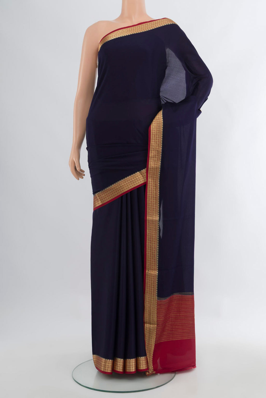 Navy Blue Mysore Crepe Saree with Plain Body and Zari Border.  displayed on a mannequin