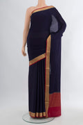 Navy Blue Mysore Crepe Saree with Plain Body and Zari Border.  displayed on a mannequin