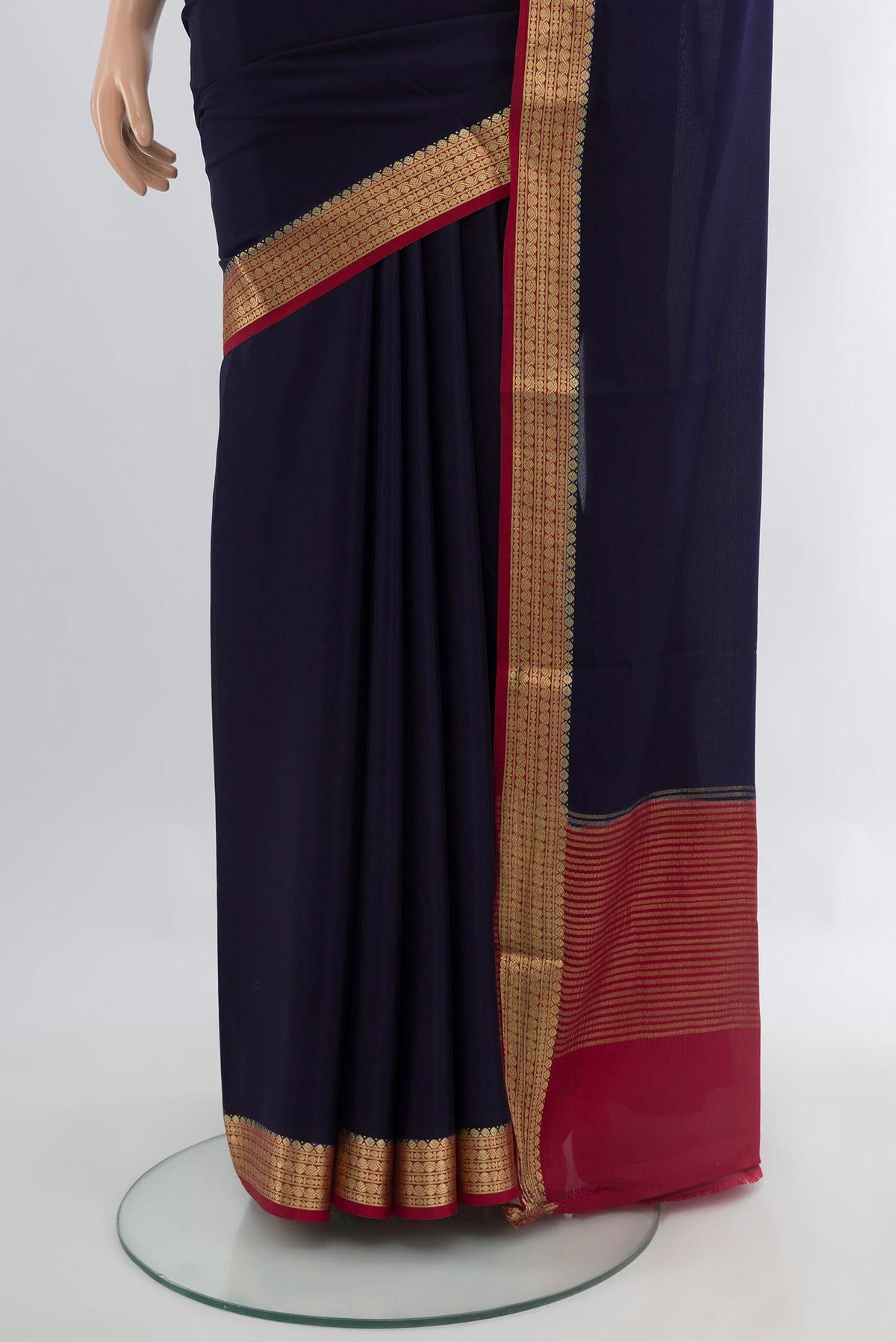 Pleats and pallu of Navy Blue Mysore Crepe Saree with Plain Body and Zari Border. 