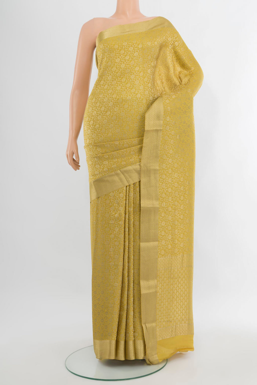 Yellow Mysore Crepe Saree with Zari Brocade on the body and Zari Border.  displayed on a mannequin