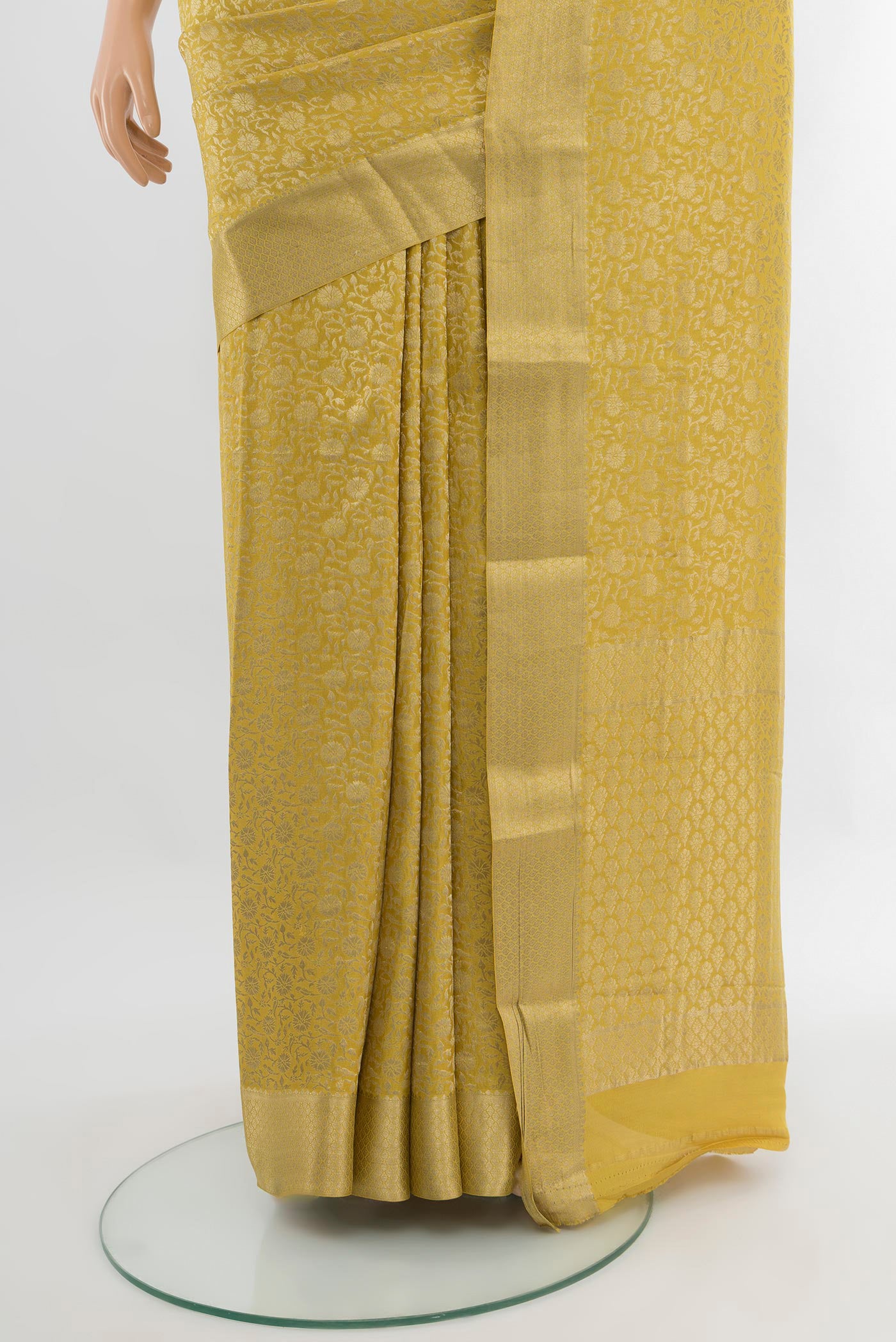 Pleats and pallu of Yellow Mysore Crepe Saree with Zari Brocade on the body and Zari Border. 