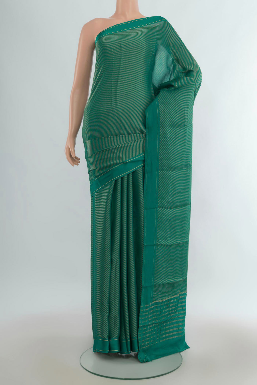 Green Mysore Georgette Saree with Zari Brocade on the body and Plain Border.  displayed on a mannequin