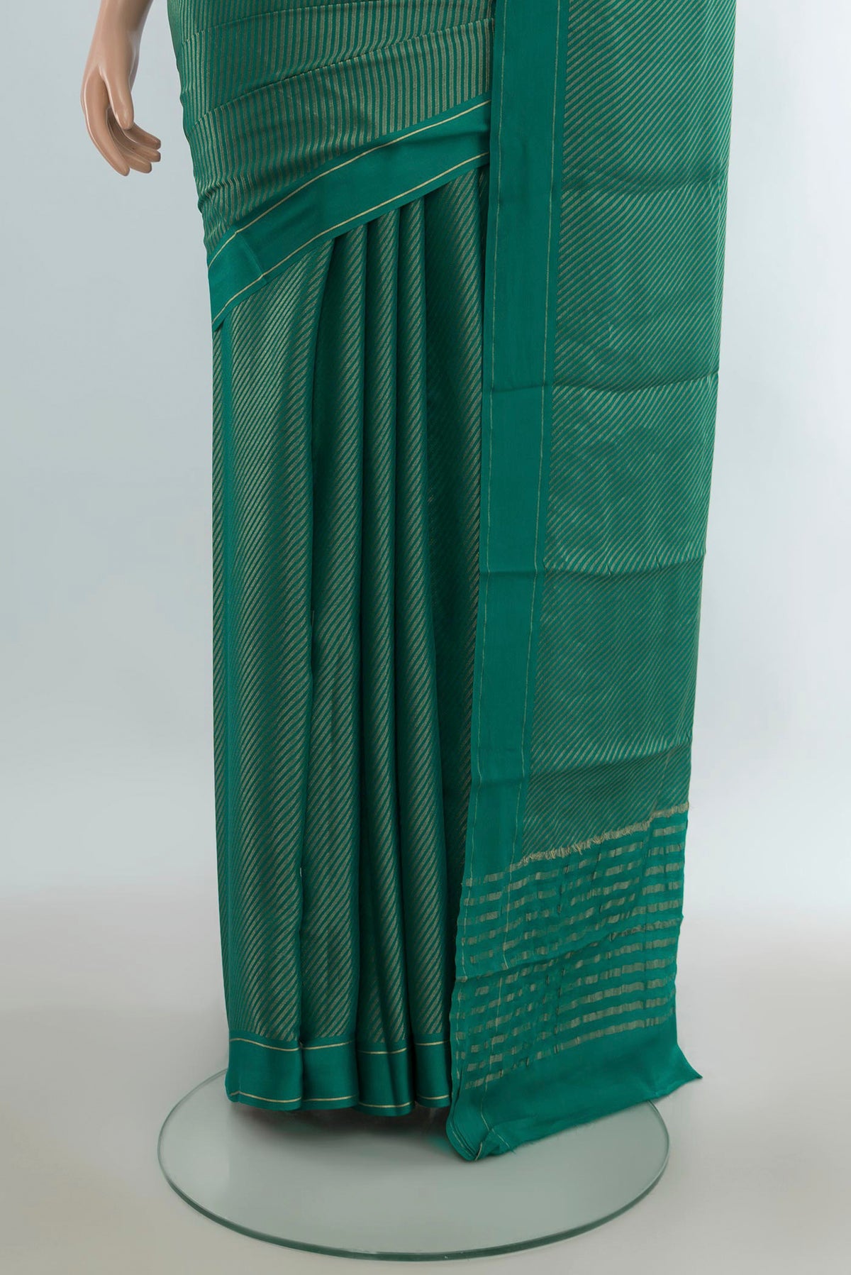 Pleats and pallu of Green Mysore Georgette Saree with Zari Brocade on the body and Plain Border. 