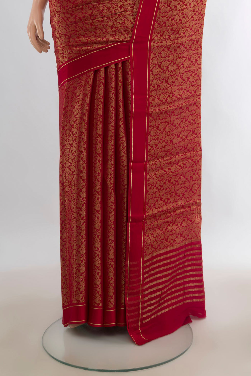Pleats and pallu of Red Mysore Georgette Saree with Zari Brocade on the body and Plain Border. 