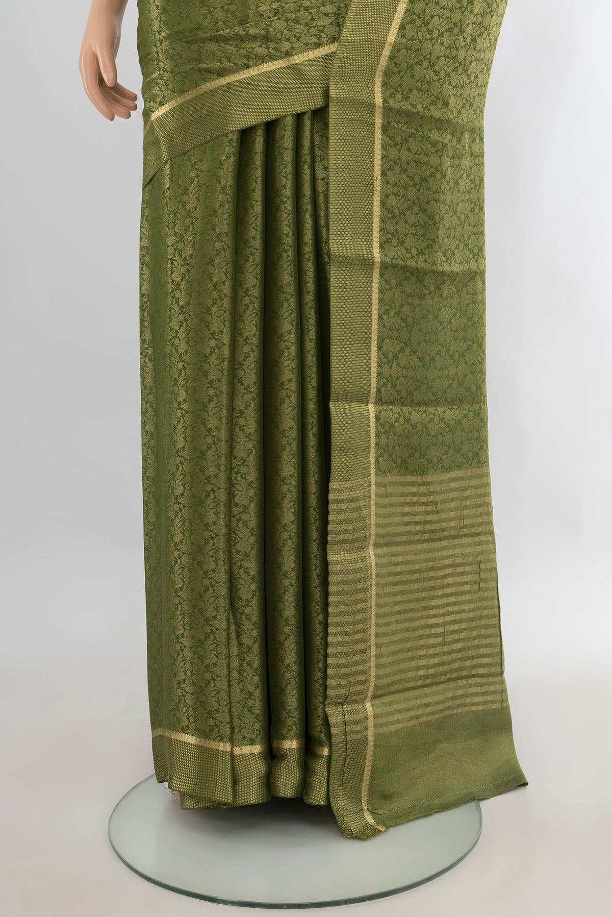 Pleats and pallu of Mehandi Green Mysore Crepe Saree with Zari Brocade on the body and Zari Border. 