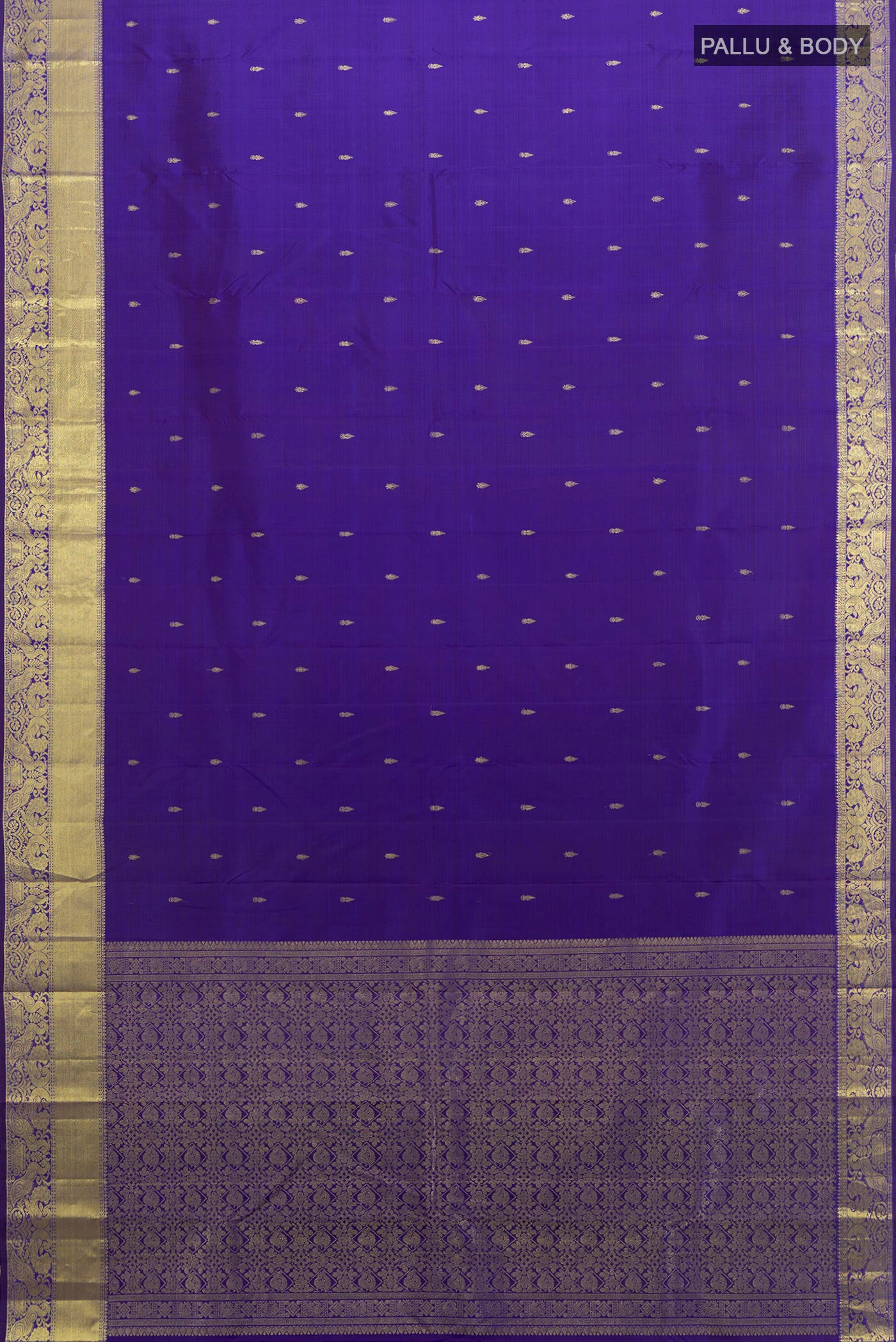 Flat view of Violet Kanchipuram Silk Saree with Zari Butta on the body and Zari Border. 