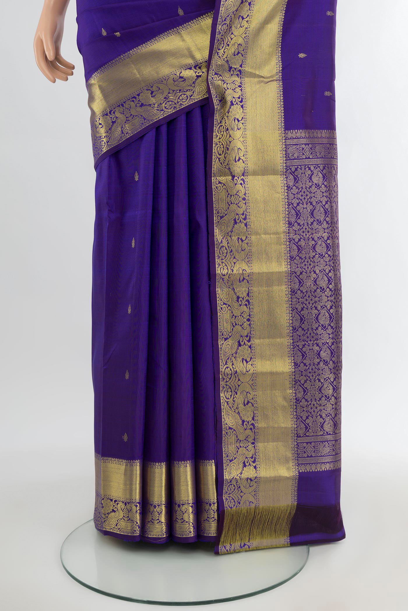 Pleats and pallu of Violet Kanchipuram Silk Saree with Zari Butta on the body and Zari Border. 