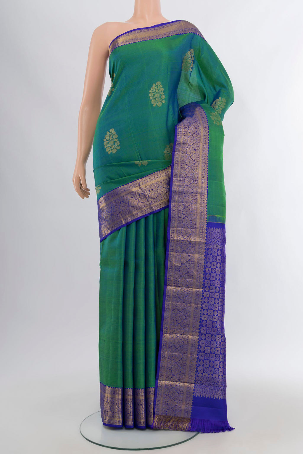 Peacock Blue Dual Tone Kanchipuram Silk Saree with Zari Butta on the body and Silk Border.  displayed on a mannequin