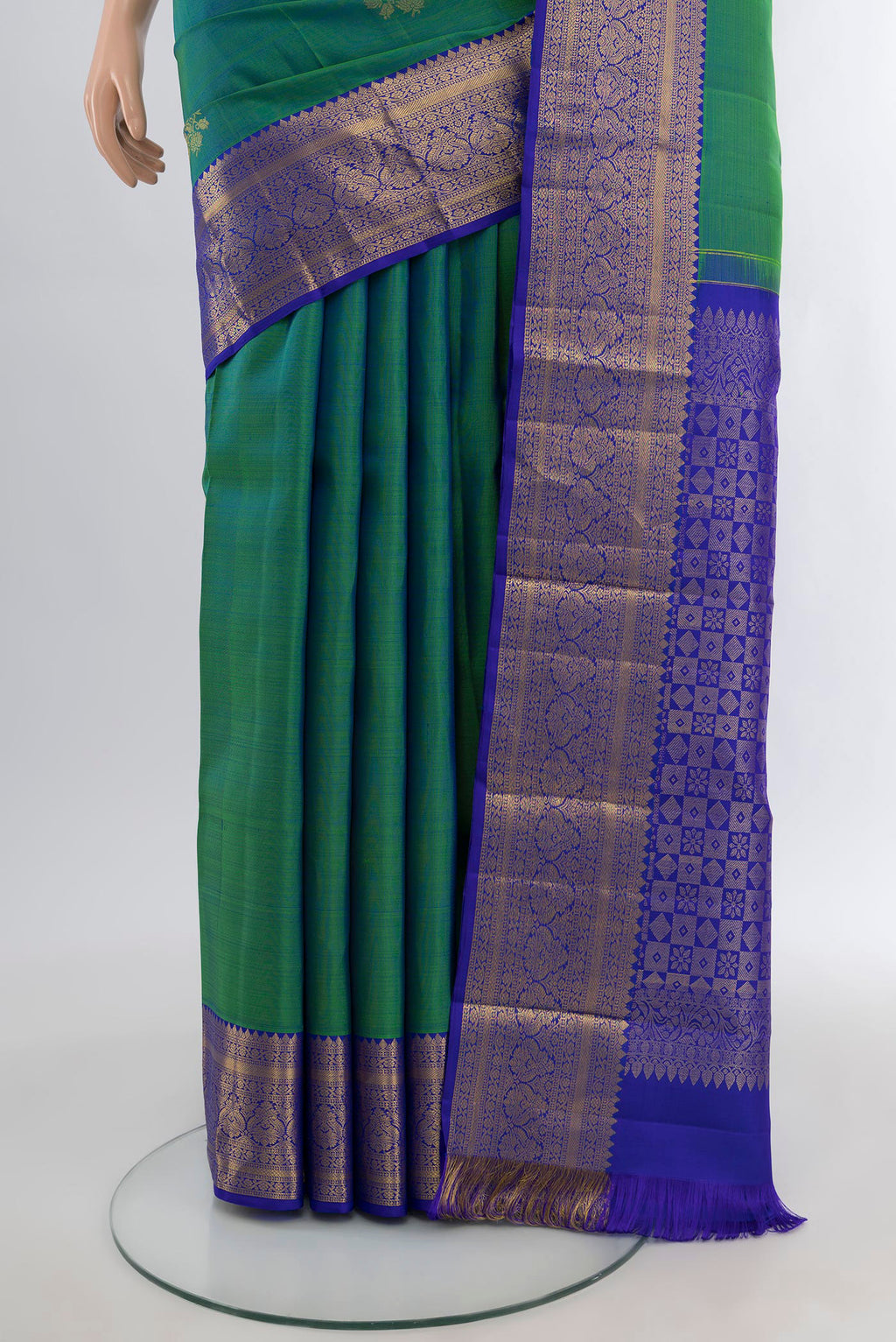 Pleats and pallu of Peacock Blue Dual Tone Kanchipuram Silk Saree with Zari Butta on the body and Silk Border. 