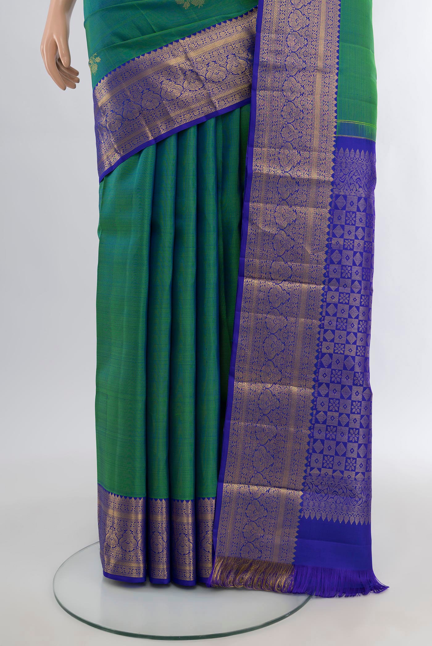 Pleats and pallu of Peacock Blue Dual Tone Kanchipuram Silk Saree with Zari Butta on the body and Silk Border. 