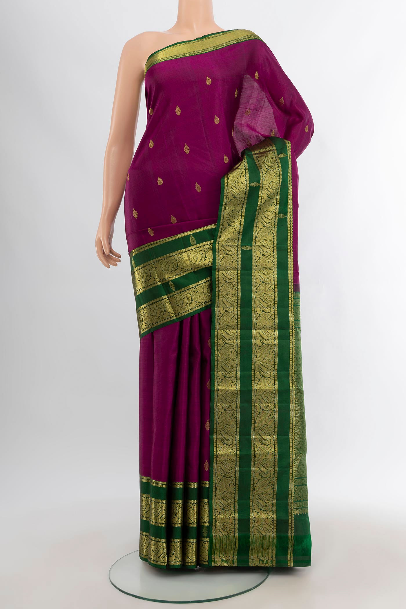 Purple Kanchipuram Silk Saree with Zari Butta on the body and Zari Border.  displayed on a mannequin