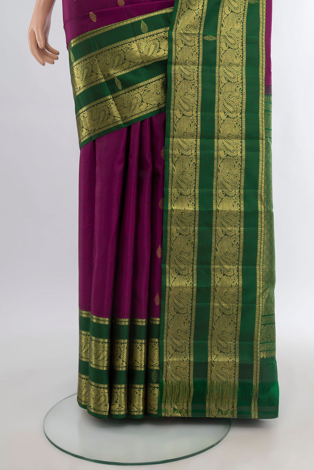 Pleats and pallu of Purple Kanchipuram Silk Saree with Zari Butta on the body and Zari Border. 