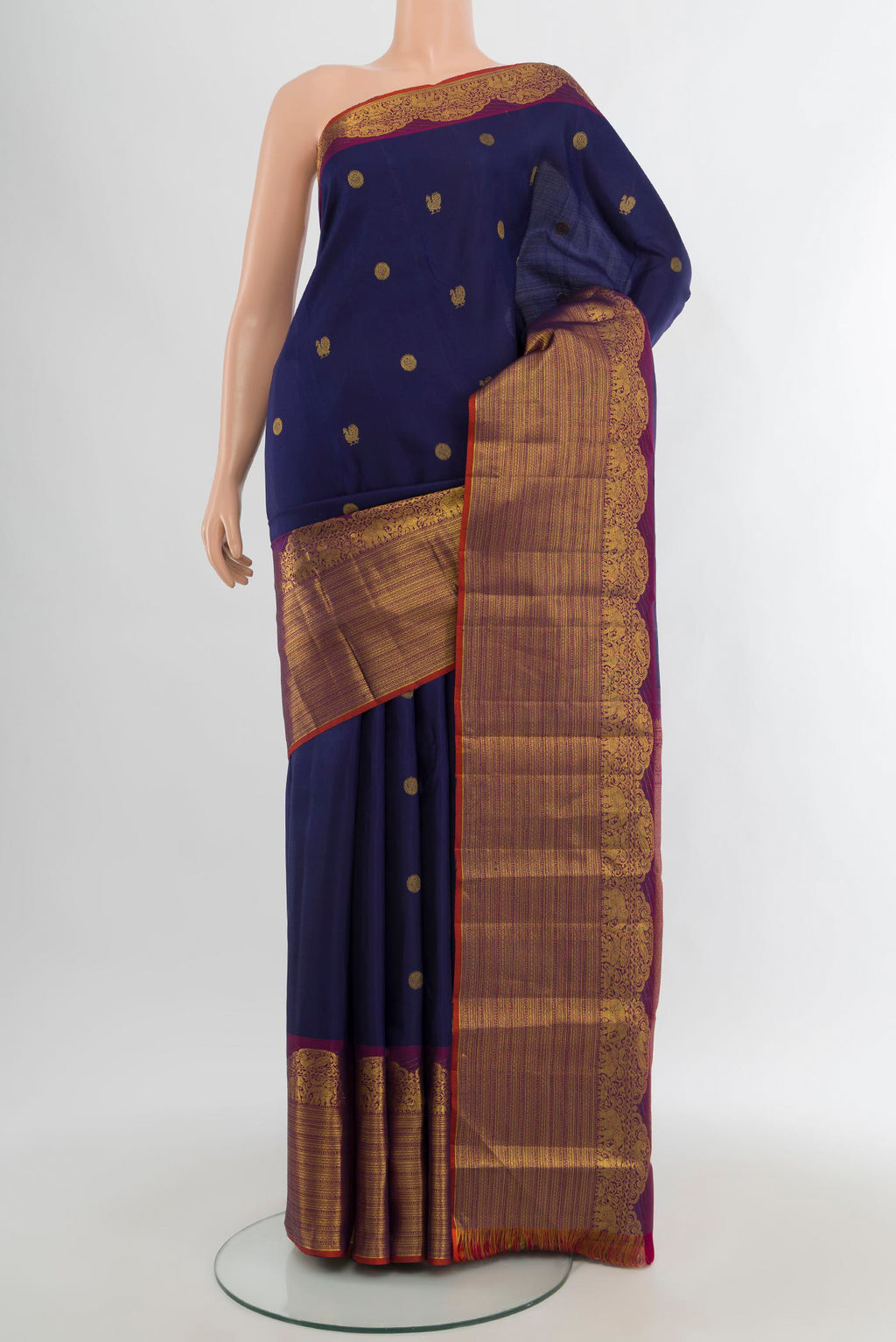 Navy Blue Kanchipuram Silk Saree with Zari Butta on the body and Fancy Border.  displayed on a mannequin